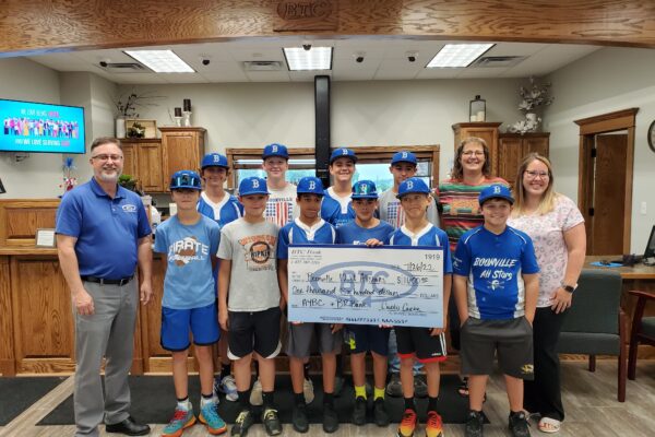 Boonville All Stars Baseball Team receive a donation from BTC Area Youth Benefit Corp in July 2022